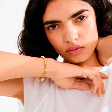 Pilgrim Armbånd til Dame udført i Messing i en flot Guld farve