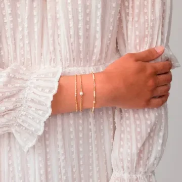 ANNI LU Armbånd til Dame udført i Messing i en flot Guld, Hvid farve