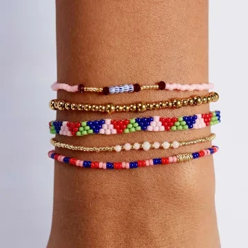 ANNI LU Armbånd til Dame udført i Messing i en flot Guld, Lyserød, Rød farve