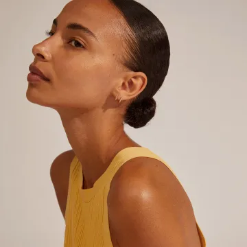 Pilgrim Øreringe til Dame udført i Messing i en flot Guld farve