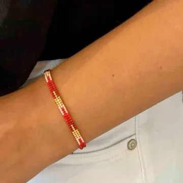 Nuni Copenhagen Armbånd til Dame udført i 925 Sterling Sølv i en flot Guld, Rød farve